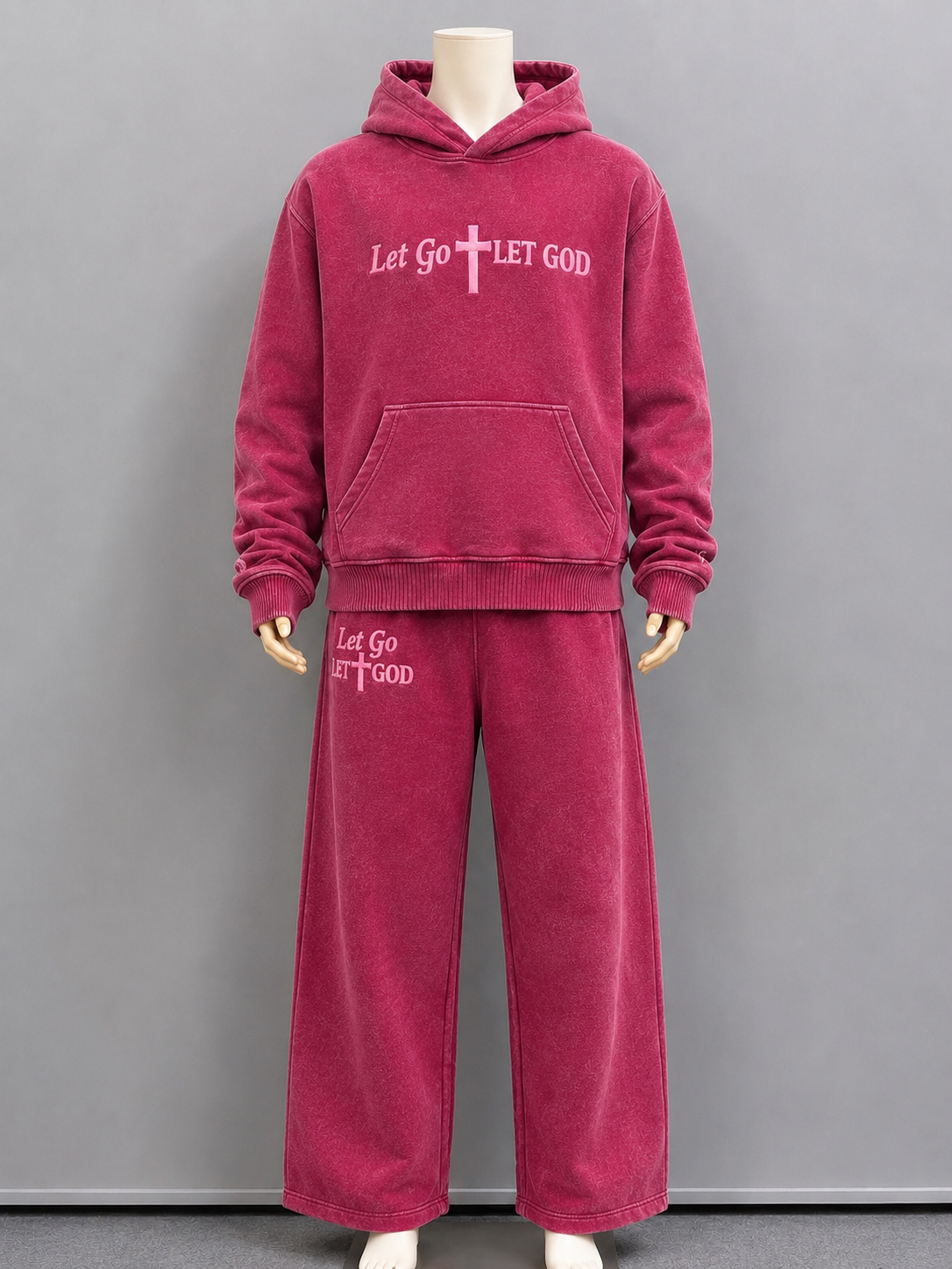 Front of our washed pink set with the embroidered "Let Go Let God" founded on the top and bottom.