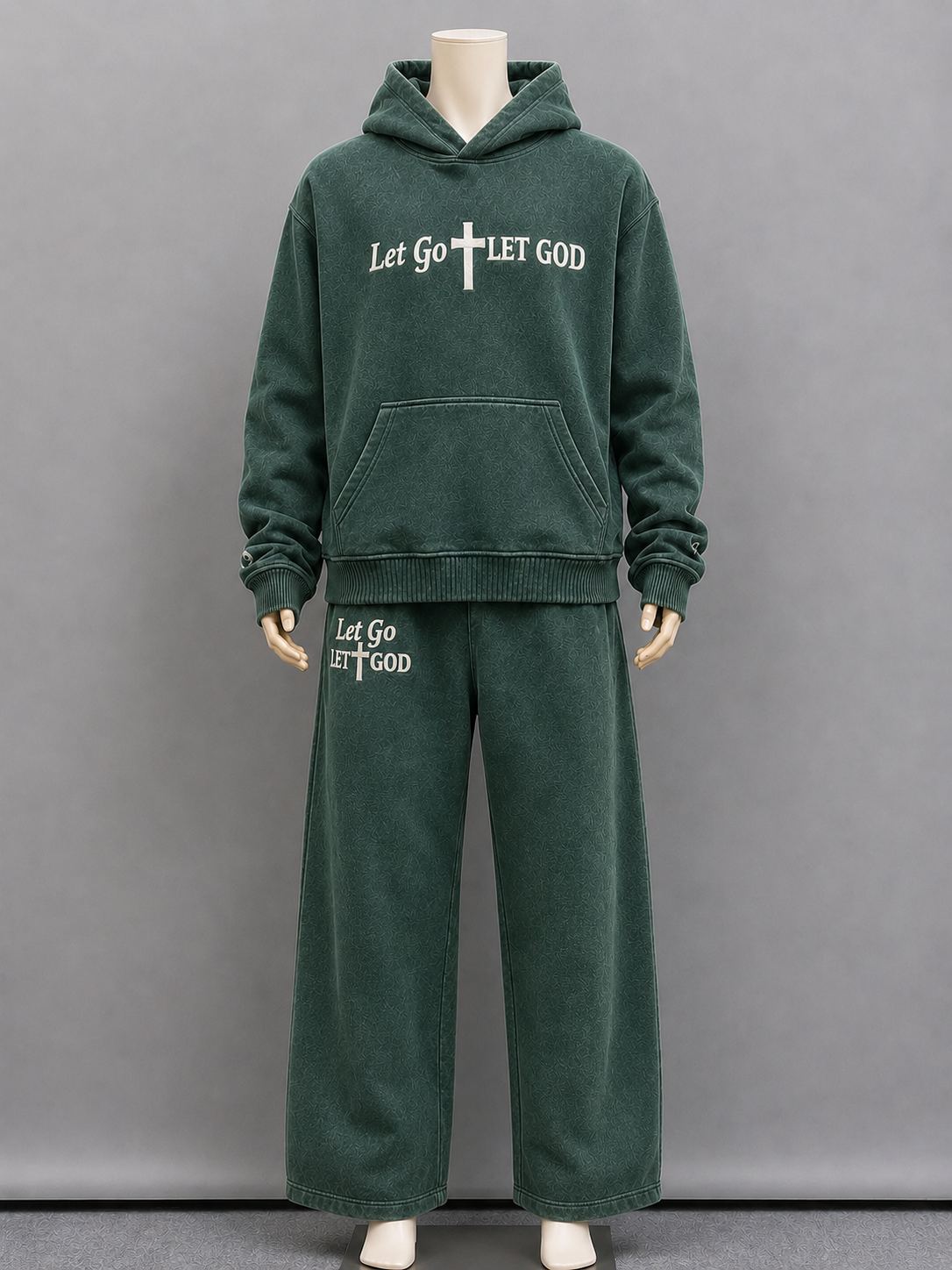 Front of our washed green set with the embroidered "Let Go Let God" founded on the top and bottom.